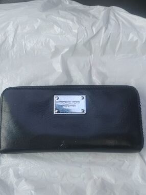 Michael Kors Black Leather Zip-Around Wallet with Silver Plaque